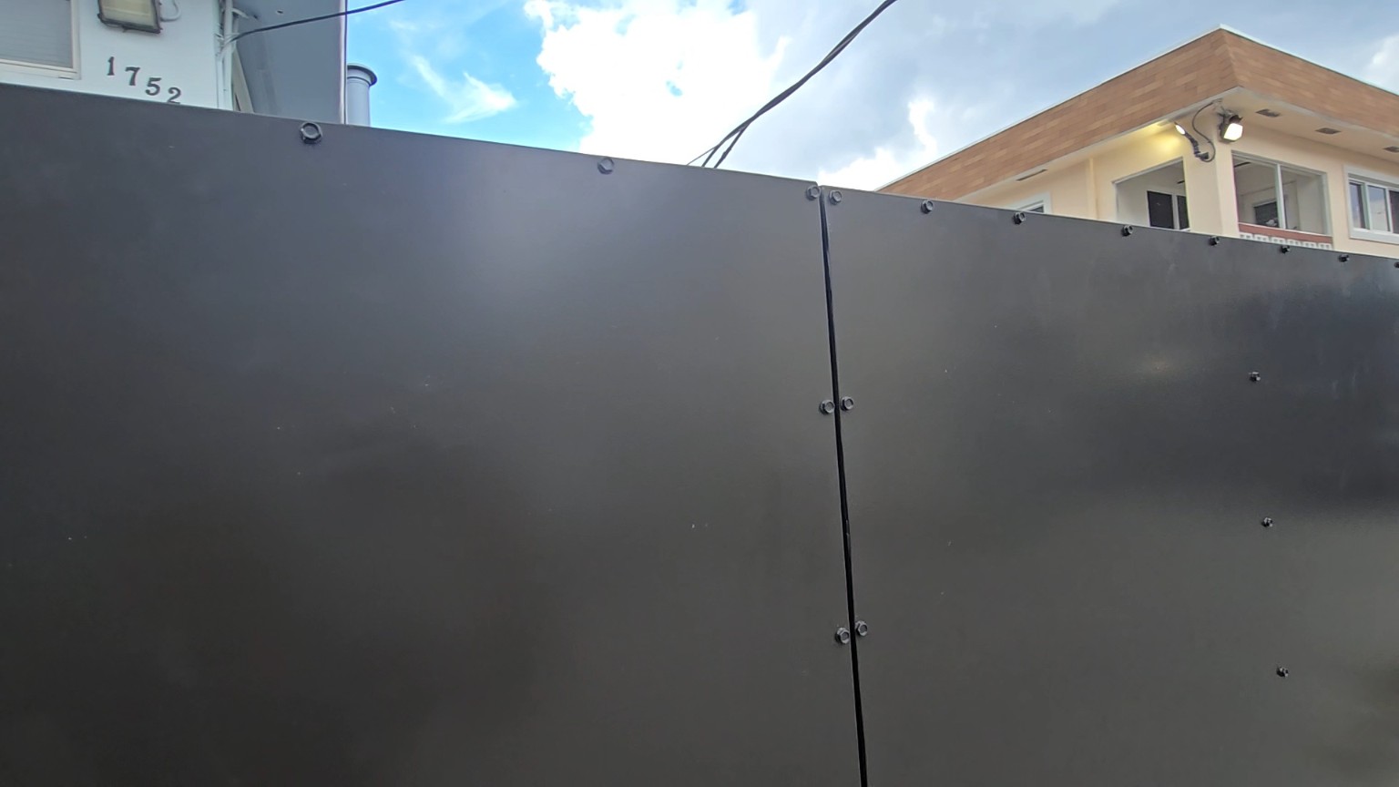 Completed dumpster enclosure doors in Pompano Beach